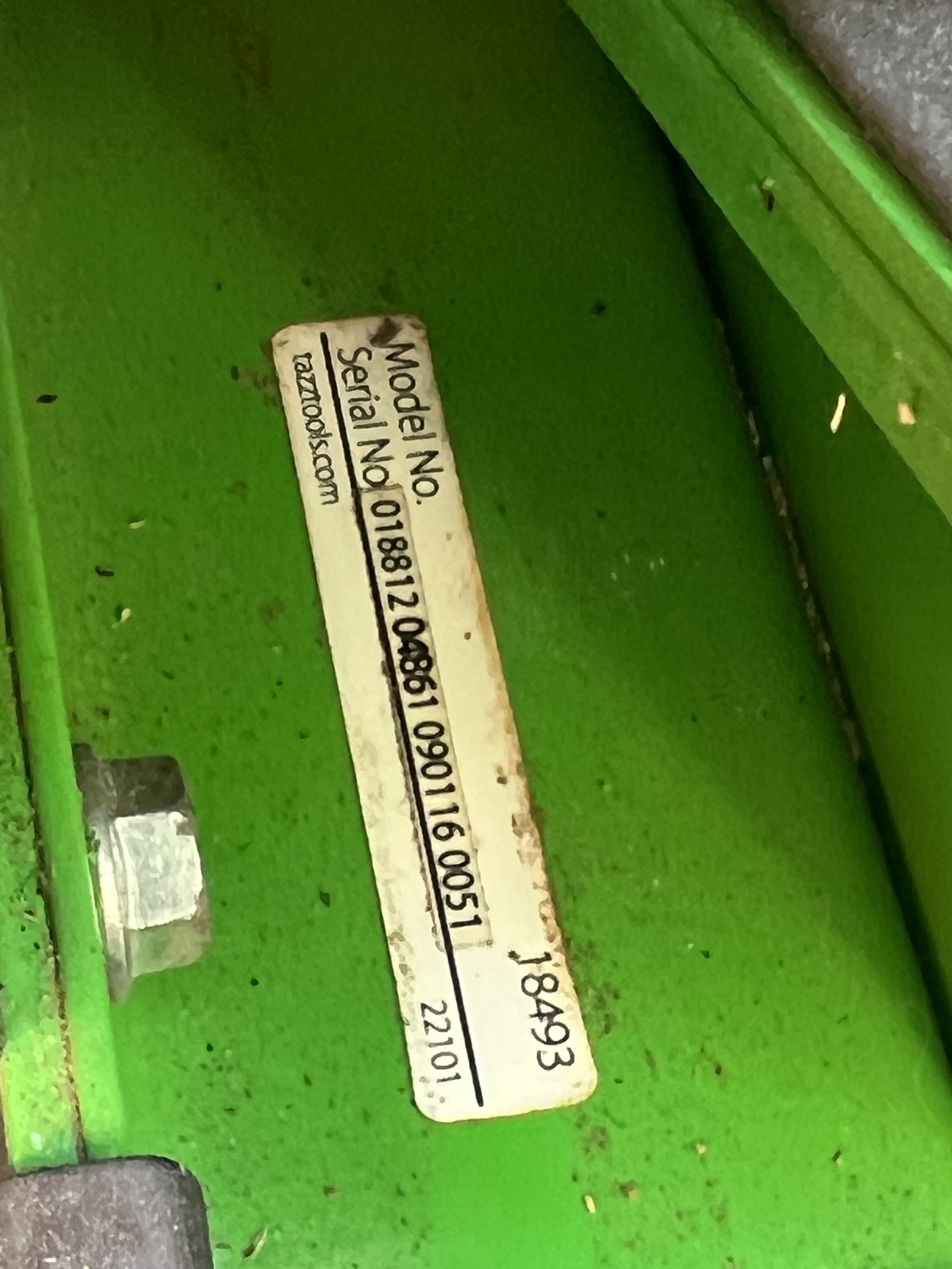 Ardisam Tazz K32 Chipper Shredder data plate — model number 18493, serial number 01881 2 04861 090116 0051, batch code 22101, tazztools.com manufacturer URL — affixed to the green discharge housing.