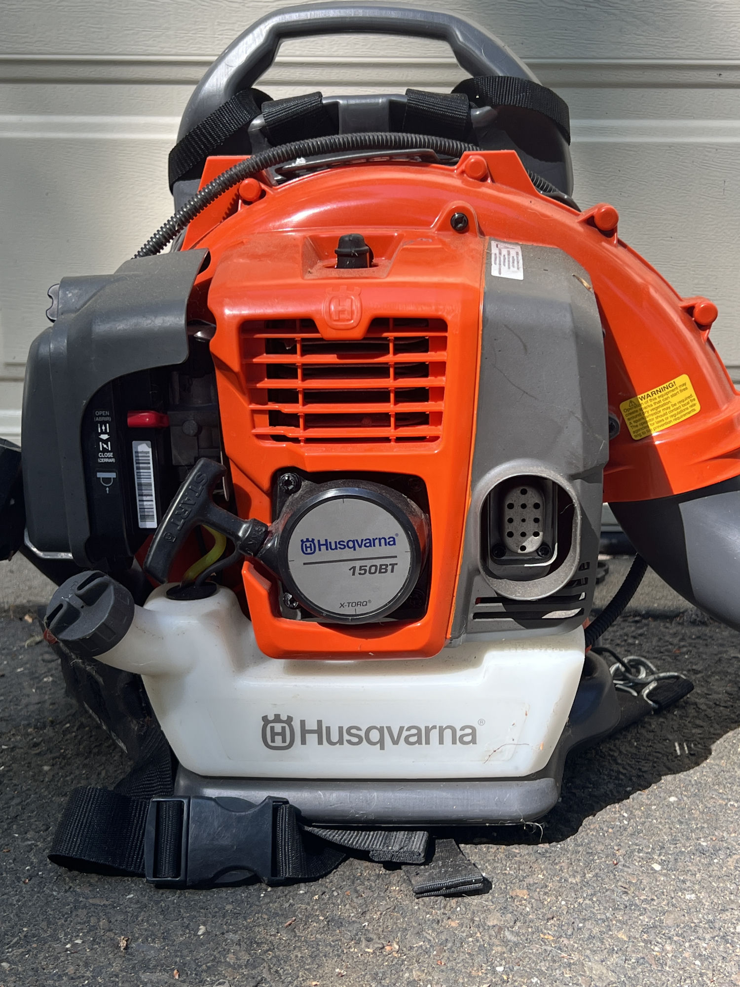 Husqvarna 150BT X-TORQ backpack blower on the driveway at New Hope.