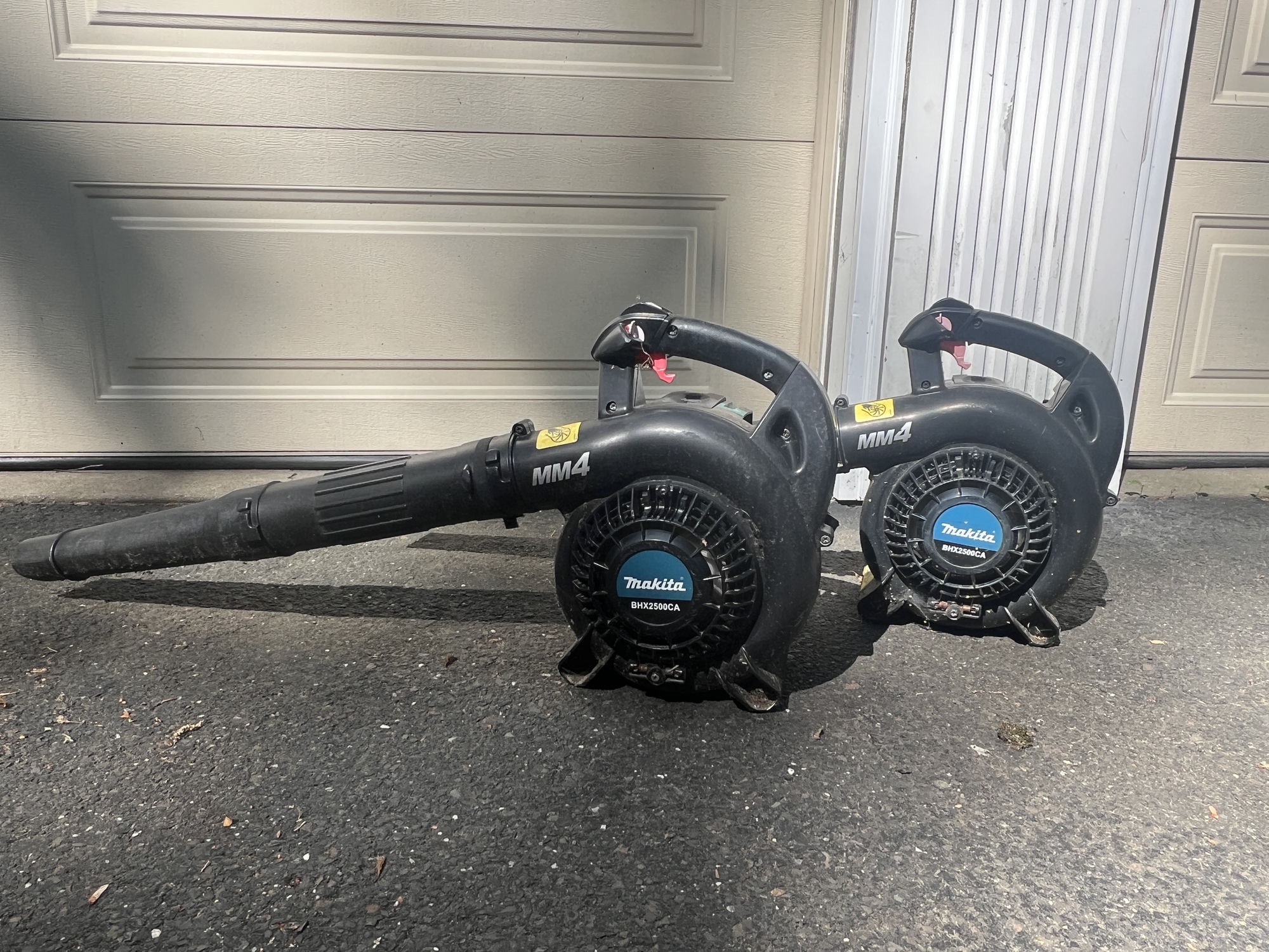 Two Makita BHX2500CA MM4 handheld blowers side by side on the driveway at New Hope.