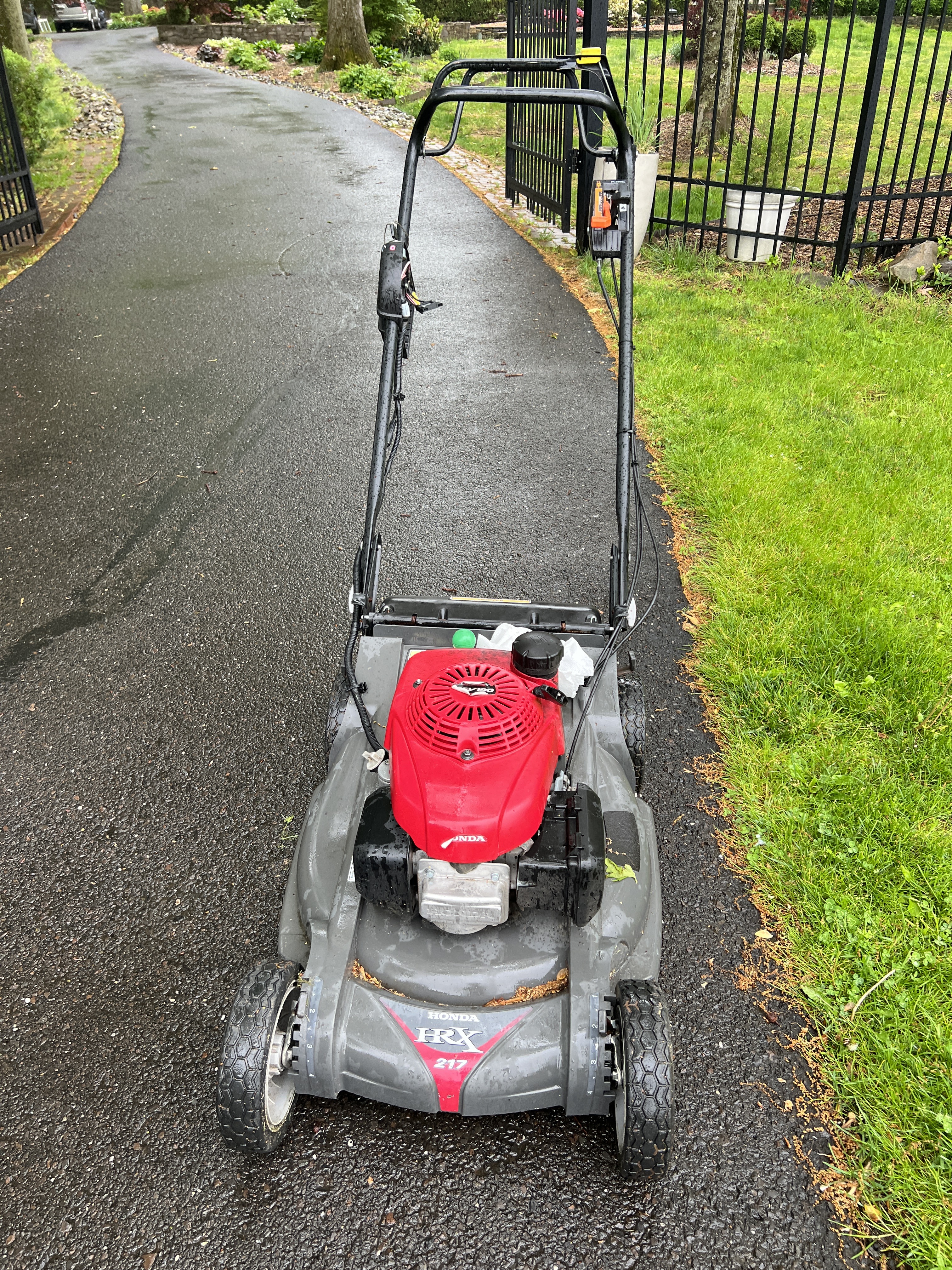 Honda HRX 217 walk-behind mower on the driveway at New Hope.
