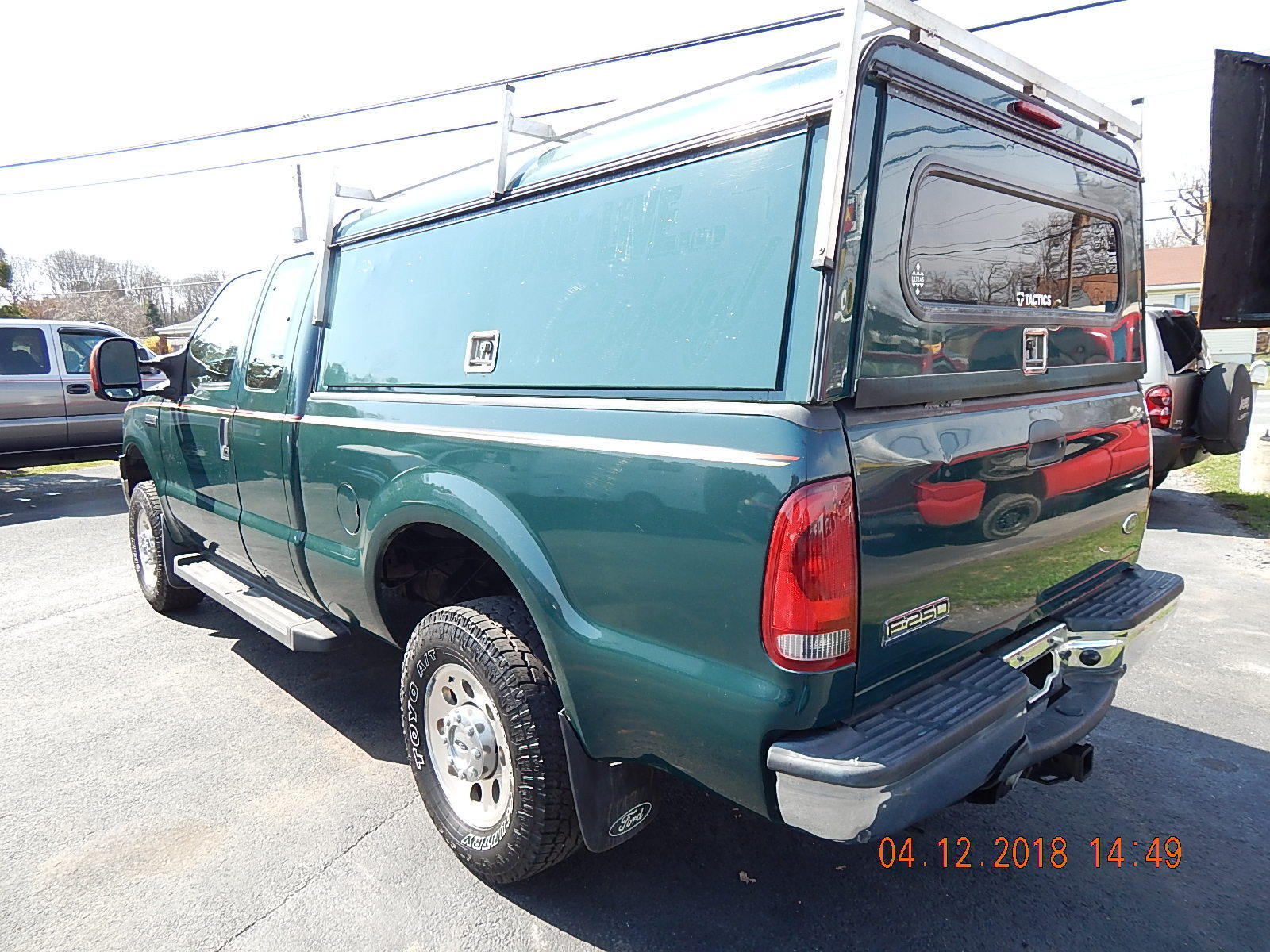 2018-04 eBay listing photo: utility topper open showing interior storage compartments with contractor wear